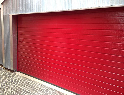 Insulated sectional garage door in red RAL colour